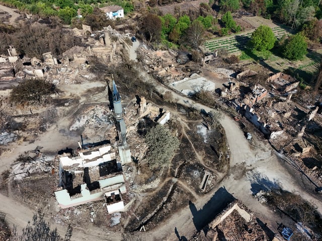 A drone view shows a destroyed mosque and houses in the aftermath of a wildfire in the village of Koprucek in Bilecik province, Turkey, July 1, 2025. REUTERS/Murad Sezer