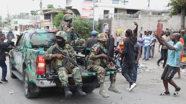 Haitian army soldiers patrol during a protest against insecurity in the capital, Port-au-Prince, on April 16.