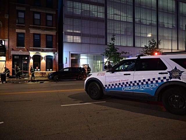 RIVER NORTH, CHICAGO, ILLINOIS, UNITED STATES - JULY 3: Chicago Fire Department cleans up the crime scene where numerous people were wounded in a shooting at Artis Restaurant and Lounge at 311 W. Chicago Ave. in the River North neighborhood during an album release party for rapper Mello Buckzz in Chicago, Illinois, United States on July 3, 2025. Preliminary reports indicate that 16 people were injured and 3 people were pronounced dead from the mass shooting. Bloodied shoes, medical debris and large pools of blood were seen at the crime scene. (Photo by Kyle Mazza/Anadolu via Getty Images)