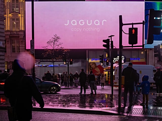 Digital screens at Piccadilly Circus display an advertisement for the Jaguar Type 00 concept car in London, UK, on Thursday, Dec. 5, 2024. Barely recognizable from the old Jaguars that are no longer on sale in the UK, the Type 00 is characterized by flush surfaces, a long hood, a glassless rear tailgate and taillights that span the width of its body. Photographer: Betty Laura Zapata/Bloomberg