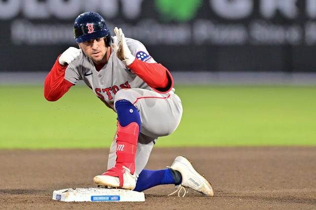 TAMPA, FLORIDA - APRIL 15: Alex Bregman #2 of the Boston Red Sox reacts after hitting an RBI double in the fourth inning against the Tampa Bay Rays at George M. Steinbrenner Field on April 15, 2025 in Tampa, Florida. All players are wearing the number 42 in honor of Jackie Robinson Day.