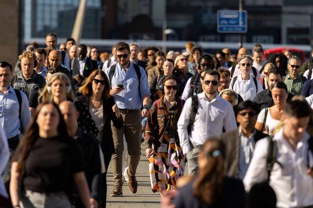 Commuters cross London Bridge, as they make their way to work in London, UK, on Monday, June 2, 2025. At least 10% of the UK's wealthy non-dom population have left the country following tighter tax rules introduced by Prime Minister Keir Starmer's Labour government, according to a new report authored by a former Treasury economist. Photographer: Jason Alden/Bloomberg via Getty Images