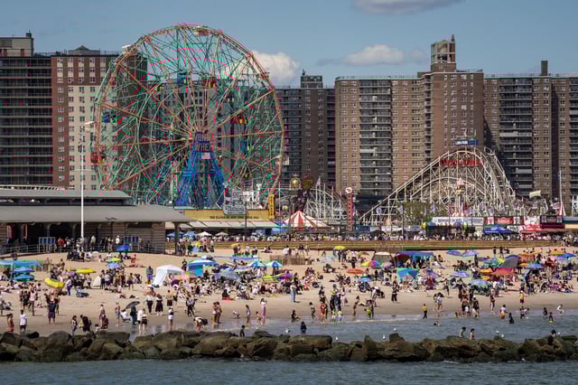 People enjoy the beach on Memorial Day at Coney Island in Brooklyn on May 26.