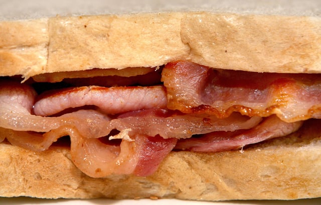 Calls to halve meat consumption. File photo dated 31/10/07 of a bacon sandwich as halving the amount of meat and dairy eaten in Europe could slash nitrogen pollution from agriculture, improve health and boost food exports, a study has suggested. Issue date: Friday April 25, 2014. Around four-fifths of nitrogen emissions in the European Union come from agriculture, for example from fertiliser and manure, and between 79% and 88% of the sector&#39;s nitrogen losses into the environment are linked to livestock production. Nitrogen emissions in the form of ammonia, nitrates and nitrous oxide can cause air, water and soil pollution and account for around 10% of the warming caused by greenhouse gases, experts said. If everyone in the EU became &#34;demitarian&#34; - halving the amount of meat and other animal products they consume - it could reduce greenhouse gases from agriculture by 25% to 40% and nitrogen emissions by 40%, the European Nitrogen Assessment&#39;s &#34;nitrogen on the table&#34; report said. See PA story ENVIRONMENT Nitrogen. Photo credit should read: Anthony Devlin/PA Wire URN:19652501 (Press Association via AP Images)