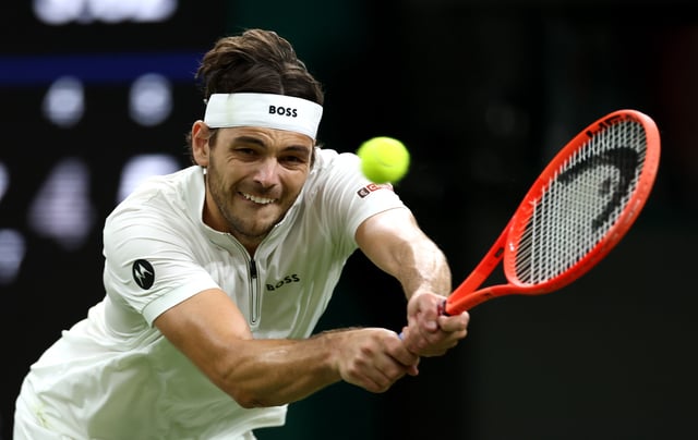 Taylor Fritz of United States plays a backhand against Gabriel Diallo of Canada during the Gentlemen&#39;s Singles second round match on day three of The Championships Wimbledon 2025 at All England Lawn Tennis and Croquet Club on July 02, 2025 in London, UK.
