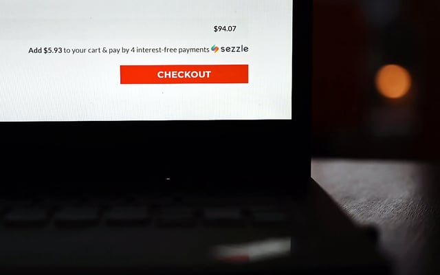 A Sezzle logo is shown in a person's online shopping cart on a laptop in Vernon, B.C. on Wednesday, November 18, 2020. THE CANADIAN PRESS/Jesse Johnston.
