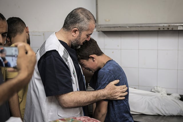 Relatives and medical staff mourn for Dr. Marwan Sultan, the director of Indonesia Hospital, and his family, who lost their lives after Israeli attack on an apartment in Junction 17, mourn for them in Gaza City, Gaza on July 02, 2025.