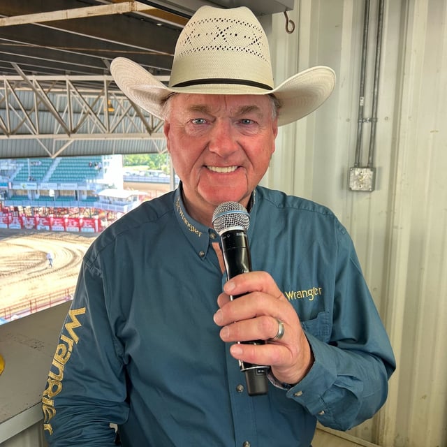 Les McIntyre speaks into the microphone at a rodeo in Alberta in an undated handout photo. The longtime announcer on the province's chuckwagon circuit is celebrating 40 years on the mic this summer, and will be the announcer at the upcoming Calgary Stampede from Sept. 4 - 13, 2025. THE CANADIAN PRESS/Handout - Kelly McIntyre (Mandatory Credit)
