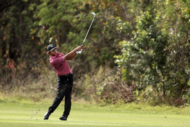 Charlie Woods of the United States plays a shot on the ninth hole during the second round of the PNC Championship at Ritz-Carlton Golf Club on December 22, 2024 in Orlando, Florida.
