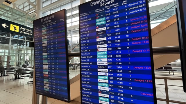 Delayed flights are shown at Winnipeg's Richardson International Airport on Thursday morning.