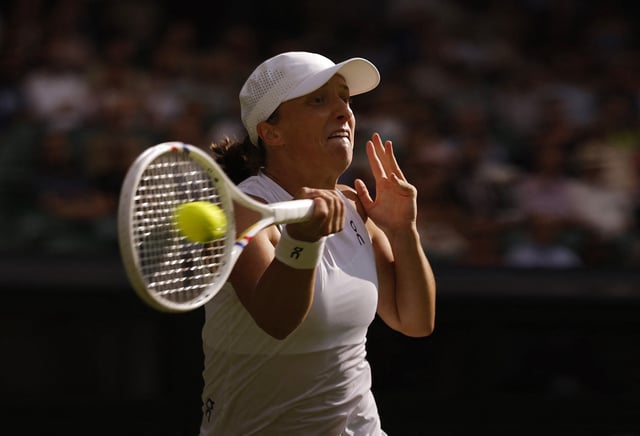 Tennis - Wimbledon - All England Lawn Tennis and Croquet Club, London, Britain - July 3, 2025 Poland's Iga Swiatek in action during her second round match against Caty McNally of the U.S. REUTERS/Andrew Couldridge