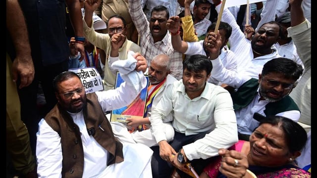 Apni Janata Party chief Swami Prasad Maurya protesting against the school merger plan in Lucknow on July 3. (HT photo)
