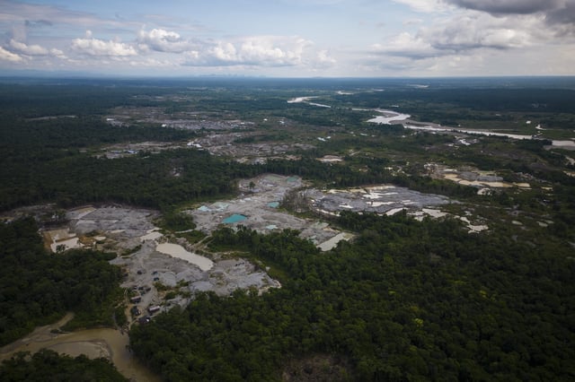 FILE - Visible deforestation from illegal mining surrounds the Quito River, near Paimado, Colombia, Sept. 23, 2024. (AP Photo/Ivan Valencia, File)