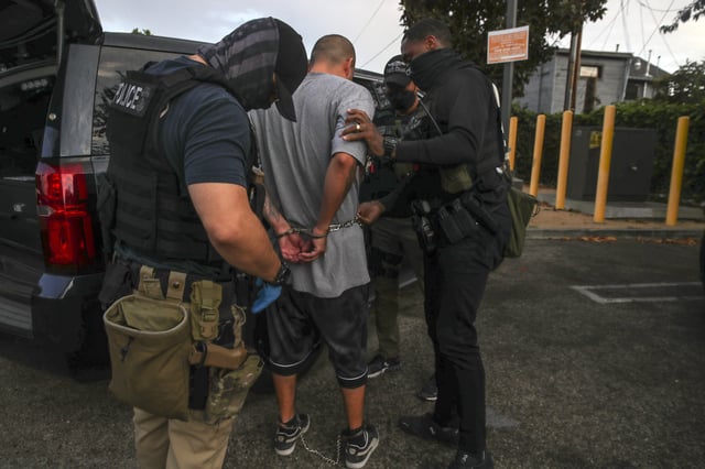 Los Angeles, CA – September 08: Immigration and Customs Enforcement agents apprehend an an illegal immigrant with criminal record, in an early morning raid at home on Thursday, Sept. 8, 2022 in Los Angeles, CA. (Irfan Khan / Los Angeles Times via Getty Images)