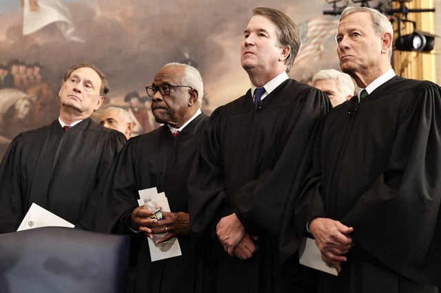 US Associate Supreme Court Justices Samuel Alito, Jr., Clarence Thomas and Brett Kavanaugh and U.S. Supreme Court Chief Justice John Roberts look on during inauguration ceremonies in the Rotunda of the U.S. Capitol on January 20, 2025, in Washington, DC.