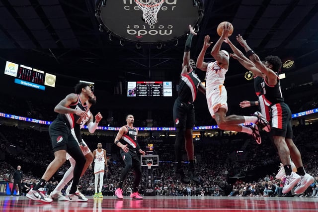 Phoenix Suns shooting guard Bradley Beal (3) shoots the ball against Portland Trail Blazers center Deandre Ayton (2, left) during the first half at Moda Center in Portland on Feb. 1, 2025.