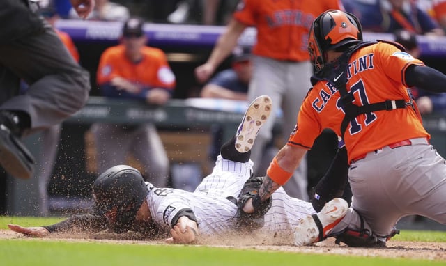 Astros catcher Victor Caratini tagged out the Rockies&#39; Tyler Freeman here to keep the score tied in the seventh inning Wednesday but the deadlock didn&#39;t last long as Colorado quickly scored the go-ahead run and win to avert a three-game sweep.