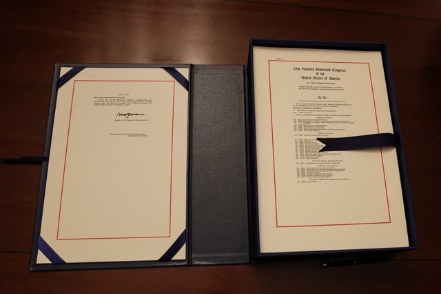 U.S. President Donald Trump's sweeping spending and tax bill is seen after U.S. House of Representatives Speaker Mike Johnson signs it, on Capitol Hill in Washington, D.C., U.S., July 3, 2025. REUTERS/Umit Bektas