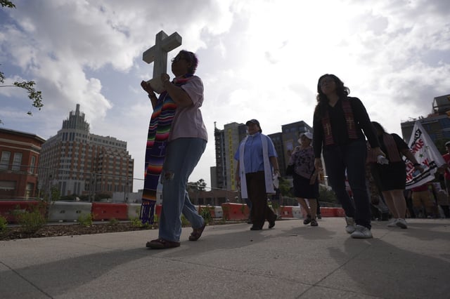 Immigration advocates protest recent detentions by ICE outside the immigration court in San Antonio, Texas, Tuesday, July 1, 2025. (AP Photo/Eric Gay)