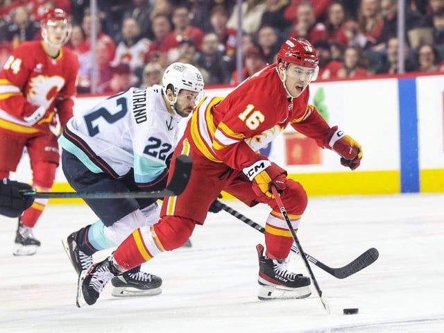 Calgary Flames centre Morgan Frost advances on the Seattle Kraken crease at the Scotiabank Saddledome in Calgary on Feb. 8, 2025. 
