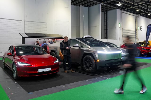 Tesla electric cars are exhibited at the Everything Electric, the Home Energy & Electric Vehicle Show, in London, Britain, April 16, 2025. REUTERS/Maja Smiejkowska/ File Photo