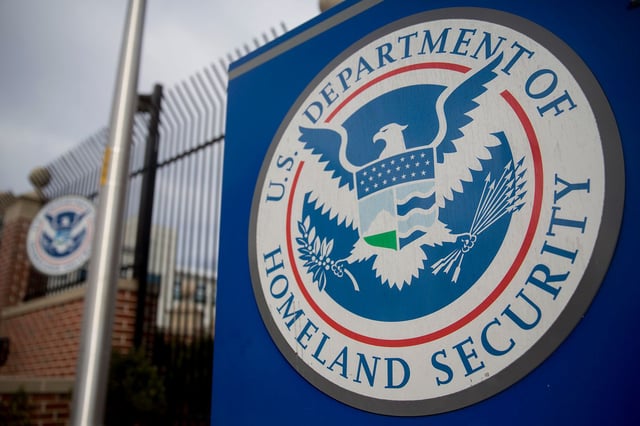 The U.S. Department of Homeland Security (DHS) seal stands at the agency's headquarters in Washington, DC, on Thursday, Dec. 11, 2014.