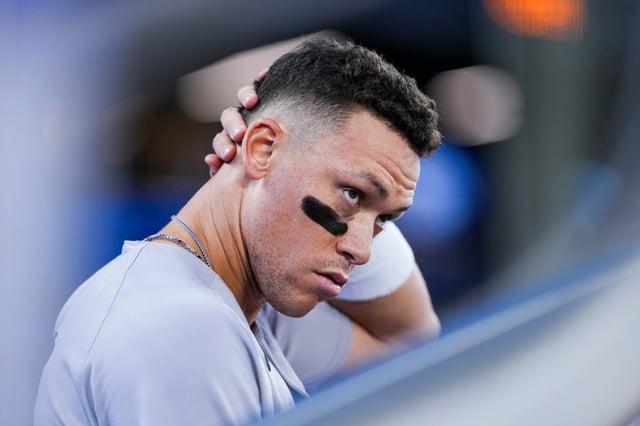 New York Yankees outfielder Aaron Judge looks on from the dugout during fifth-inning baseball game action against the Toronto Blue Jays in Toronto, Thursday, July 3, 2025. (Thomas Skrlj/The Canadian Press via AP)