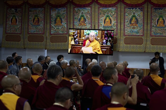 Buddhist monks of various schools of Tibetan Buddhism watch a recorded video message by Tibetan spiritual leader the Dalai Lama in Dharamshala, India, Wednesday, July 2, 2025, ahead of his birthday according to the Gregorian calendar on July 6. (AP Photo/Ashwini Bhatia)