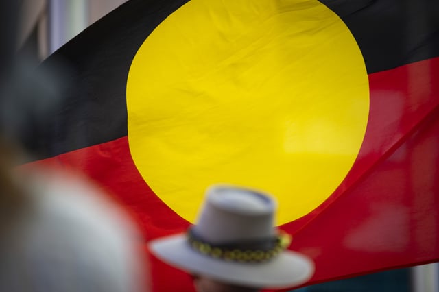 PERTH, AUSTRALIA - OCTOBER 7: An Aboriginal flag is seen through the crowd at the &#34;Stop Black Deaths In Custody&#34; march on October 7, 2023 in Perth, Australia. With Australia&#39;s historic referendum on the Indigenous Voice to Parliament just a week away, activity in the leadup to it has been at fever pitch in both the YES and NO camps. The Stop Black Deaths In Custody events were held against the backdrop of the referendum, which will take place on Oct. 14. (Photo by Matt Jelonek/Getty Images)