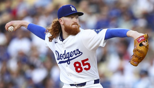 Dodgers starting pitcher Dustin May throws to the plate during the first inning of a game against the Chicago White Sox on Thursday night at Dodger Stadium. May took a shutout into the eighth inning, allowing two runs on four hits and one walk in seven-plus innings with nine strikeouts in a 6-2 win. (AP Photo/Jessie Alcheh)