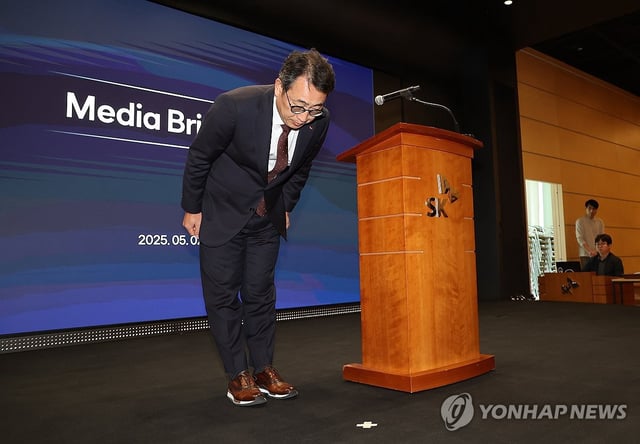 In this May 2, 2025, photo provided by SK Telecom Co., CEO Ryu Young-sang bows during a press briefing on a data breach at the headquarters of South Korea's largest wireless carrier in central Seoul. (Yonhap)