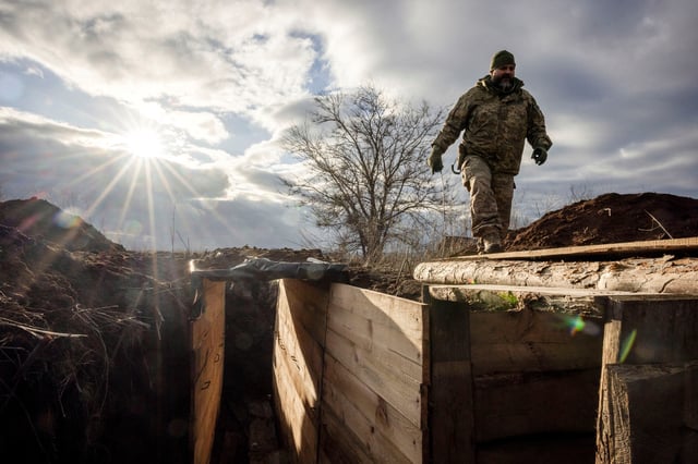 Ukrainian military engineer with the callsign Lynx inspects a freshly dug trench that his unit built as part of a system of new fortifications near the front lines outside Kupiansk, amid Russia?s attack on Ukraine, December 28, 2023.  REUTERS/Thomas Peter/File Photo