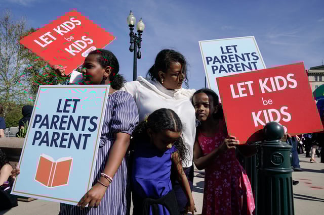 People supporting the right to opt-out their children from classes containing LGBTQ-related content demonstrate outside the Supreme Court, as the court hears oral arguments in the Mahmoud v. Taylor case, in Washington, DC, April 22, 2025.