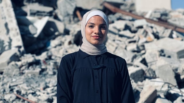 Meera, a university student who has been accepted into a master's program at the University of Regina, is stranded in Gaza City, where she's unable to submit a completed visa application to the federal government. 