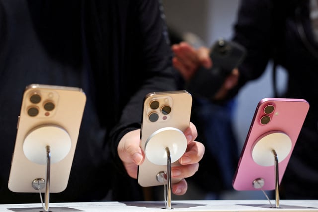 A man checks an iPhone 16 Pro as the new iPhone 16 series smartphones go on sale at an Apple store in Beijing, China September 20, 2024. REUTERS/Florence Lo/File Photo