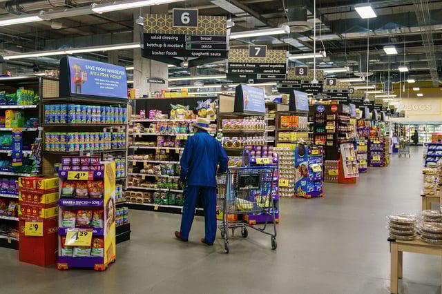 Shoppers walk the aisles of a Kroger supermarket on October 14, 2022, in Atlanta. Most grocery stores under Kroger will be open during their regular hours on July 4.