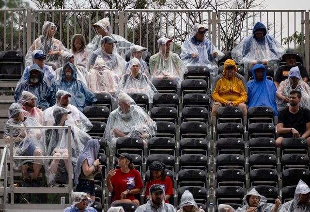 Fans watch from their seats while it rains during the NASCAR Chicago Street Race, July 7, 2024. (Brian Cassella/Chicago Tribune)