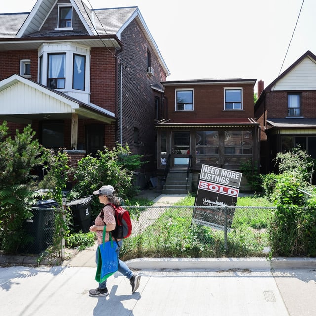 A 'Sold' sign is seen out front of a home in Toronto's west end on Tuesday, June 17, 2025. (Cole Burston/The Globe and Mail)