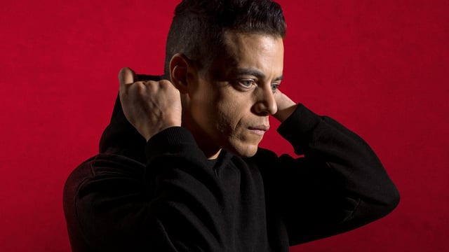 Rami Malek putting up his Mr. Robot hood.