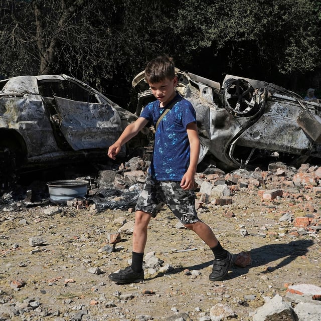 Damaged cars lie in a yard among other debris after a Russian drone and missile attacks in Kyiv, Ukraine, Friday, July 4, 2025. (AP Photo/Efrem Lukatsky)
