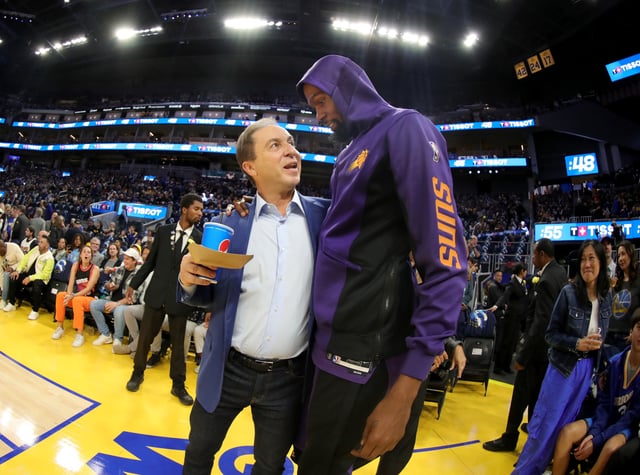 Golden State Warriors majority owner Joe Lacob talks with Phoenix Suns' Kevin Durant (35) before the start of the season opener at Chase Center in San Francisco, Calif., on Tuesday, Oct. 24, 2023. (Photo by Ray Chavez/MediaNews Group/The Mercury News via Getty Images)