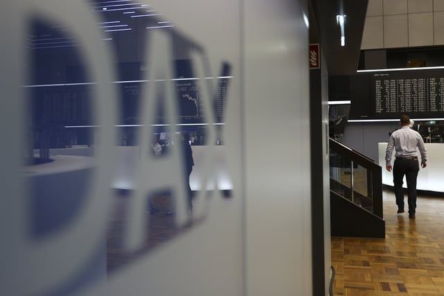 The German stock market index DAX is reflected in a logo at the Frankfurt Stock Exchange in Frankfurt, Germany, October 14, 2016. REUTERS/Kai Pfaffenbach/File Photo