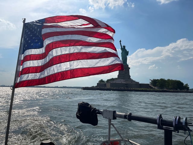 An American flag flys from the back of a NYPD boat on July 3, 2025.