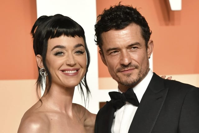 FILE - Katy Perry and Orlando Bloom appear at the Vanity Fair Oscar Party in Beverly Hills, Calif., on March 2, 2025. (Photo by Evan Agostini/Invision/AP, File)