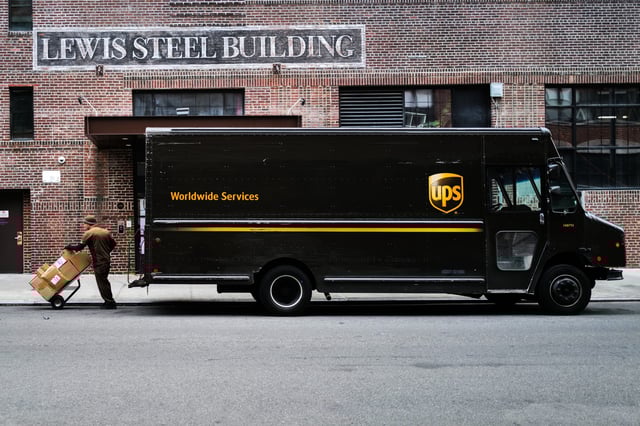 A UPS driver makes a delivery in the Brooklyn borough of New York on March 26, 2024.
