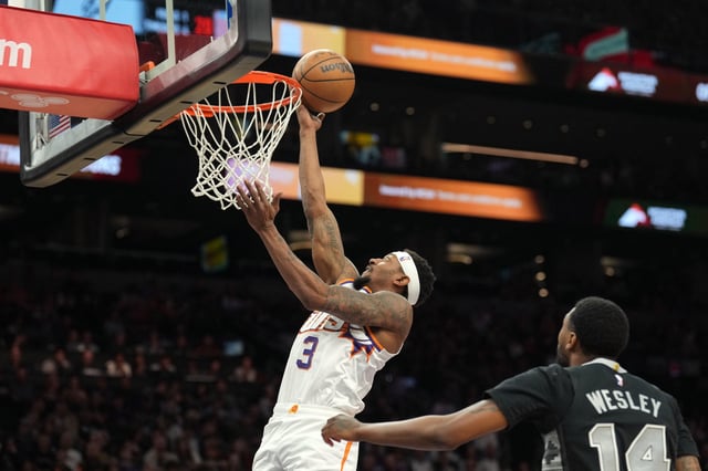 Apr 11, 2025; Phoenix, Arizona, USA; Phoenix Suns guard Bradley Beal (3) puts up a layup against San Antonio Spurs guard Blake Wesley (14) during the second half at Footprint Center. Mandatory Credit: Joe Camporeale-Imagn Images/File Photo