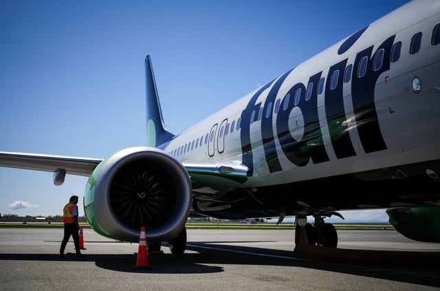 Plane-leasing companies that seized four aircraft from Flair Airlines in 2023 are seeking US$30.9 million in damages from the budget carrier, alleging it failed to make rent payments by deadline and ignored repeated default notices. Flair Airlines captain Ken Symonds inspects the outside of one of the company's Boeing 737 MAX 8 aircraft while parked at a gate at Vancouver International Airport, in Richmond, B.C., on Wednesday, April 17, 2024. THE CANADIAN PRESS/Darryl Dyck