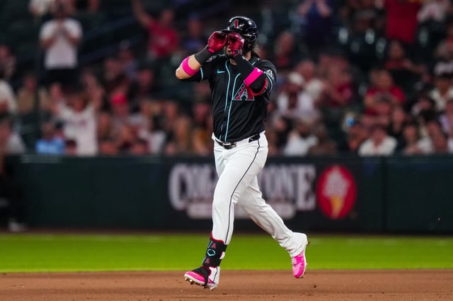 PHOENIX, ARIZONA - JUNE 30: Eugenio Suárez #28 of the Arizona Diamondbacks celebrates after hitting a solo home run during the eighth inning against the San Francisco Giants at Chase Field on June 30, 2025 in Phoenix, Arizona.