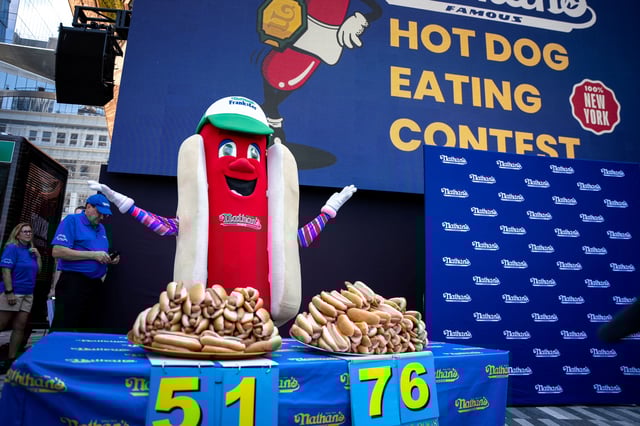Frankie, the mascot for Nathan's Famous hot dogs, excites the audience at the official weigh-in ceremony, ahead of the Coney Island's 2025 Nathan's Famous Fourth of July International Hot Dog Eating Contest in New York City, U.S., July 3, 2025. REUTERS/Angelina Katsanis