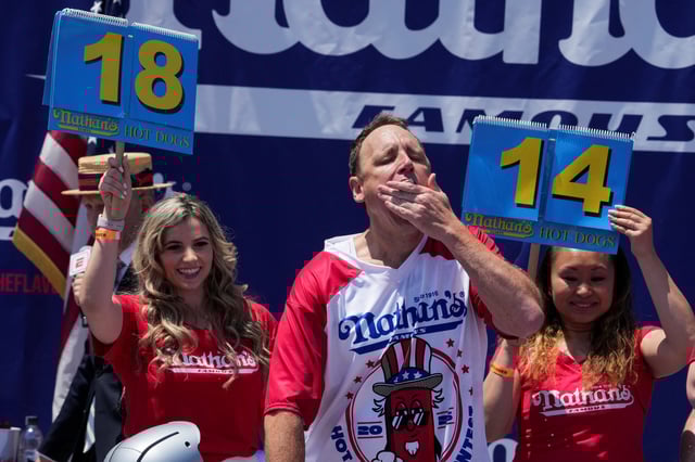 Joey Chestnut, a multi-time winner, competes during the 2025 Nathan's Famous International Hot Dog Eating Contest, at Coney Island, Brooklyn in New York City, U.S., July 4, 2025. REUTERS/David 'Dee' Delgado